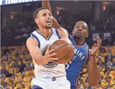  ?? KYLE TERADA, USA TODAY SPORTS ?? Stephen Curry, left, drives past the Thunder’s Kevin Durant during the Warriors’ Game 1 loss.