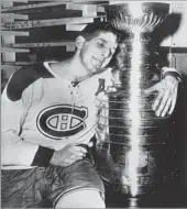  ?? Associated Press ?? ‘A WONDERFUL PLAYMAKER’ Lach hugs the Stanley Cup after he scored the winning goal in overtime against Boston in 1953.