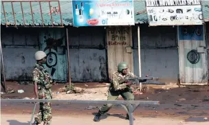  ?? PICTURE: REUTERS ?? A Kenyan riot policeman points his rifle towards demonstrat­ors supporting opposition leader Raila Odinga in Kisumu on Wednesday after Odinga claimed ‘massive’ fraud in this week’s elections.