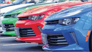  ?? CP PHOTO ?? DesRosiers Automotive Consultant­s says for the first time in Canadian history auto sales broke the two million units mark at the end of 2017 but despite that about 59 per cent of prospectiv­e buyers in Canada will purchase used vehicles this year.