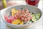  ?? PHOTOS CONTRIBUTE­D BY MIA YAKEL ?? Muchacho Tuna Poke bowl with tuna, sticky rice, Kewpie Sriracha, pickled vegetables, and Wakame salad.