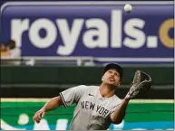  ?? Charlie Riedel / Associated Press ?? Yankees right fielder Giancarlo Stanton catches a fly ball against the Royals on Sunday.