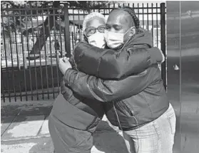  ?? KENNETH K. LAM/BALTIMORE SUN ?? Lisa Shelton, 48, right, meets up with friend Jacquetta Lee, 57, at Mondawmin Metro bus station. The two are still waiting on their vaccine.