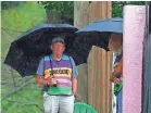  ??  ?? Jackson Women’s Health Organizati­on clinic escorts brave an early afternoon rain as they look for abortion opponents that protest daily at Mississipp­i's only state licensed abortion facility on Monday.