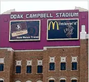  ?? WARCHANT.COM ?? Some FSU fans are upset about the signs on the rear of the south end scoreboard. The signs overlook Langford Green and the Unconquere­d statue.