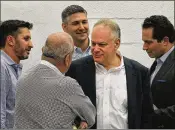  ?? MIAMI HERALD 2016 ?? Stephen Bittel (center, in 2016) stepped down as chair of the Florida Democratic Party after being accused of leering at aides and generating such a creepy atmosphere that some women didn’t want to be alone with him.