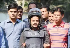  ?? — AFP ?? Bangladesh police escort alleged militant Jahangir Alam (C) in Dhaka on Saturday after his arrest in connection with an attack on the Holey Artisan Bakery attack last year.