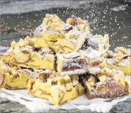  ??  ?? Baked French toast gets a shower of powdered sugar.