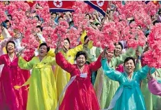  ??  ?? North Korean women at a mass rally before Kim Jong-un in Pyongyang yesterday