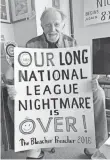  ??  ?? Cubs fan Jerry Pritikin, known around Wrigley Field as the Bleacher Preacher, shows off a sign he made for the NL Championsh­ip Series. AAMER MADHANI, USA TODAY