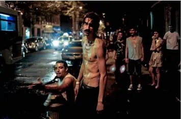  ??  ?? Above: ‘Playing in a busted fire hydrant on the 4th of July’ by Peter Van Atgmael. New York City, USA, 2010.