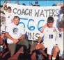  ?? Joe Morelli / Hearst Connecticu­t Media ?? Old Saybrook boys soccer coach Steve Waters is surrounded by his team after he won his 566th career game, setting a CIAC record, on Sept. 10.