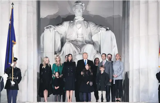  ?? Picture / AP ?? Donald Trump stands with his family during the Make America Great Again Welcome Concert at the Lincoln Memorial in Washington yesterday.