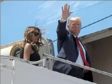  ?? Evan Vucci/ Associated Press ?? President Donald Trump and first lady Melania Trump board Air Force One at Wright- Patterson Air Force Base on Wednesday after meeting with people affected by the mass shooting in Dayton, Ohio.