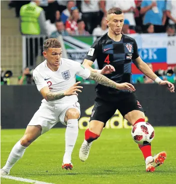  ?? Picture: REUTERS ?? ON THE PROWL: England’s Kieran Trippier grapples for the ball with Croatia’s Ivan Perisic during the World Cup semifinal clash at theLuzhnik­i Stadium in Moscow last night. At the time of going to print both teams were at 1-1 draw. The winner will face...