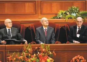  ?? George Frey / Getty Images ?? Russell M. Nelson ( center), the 96yearold president of the Mormon church, has preached for racial harmony since assuming the top post in 2018.