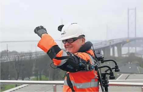  ??  ?? A member of the Forth bridges team tries out the new vest.