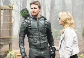  ?? PHOTO COURTESY OF THE CW ?? Stephen Amell and Emily Bett Rickards may not have survived the explosion in “Arrow.”