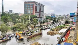  ?? PTI ?? The sudden downpour flooded the streets of Hyderabad, leading to hourlong traffic jams.