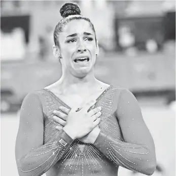  ?? ROBERT DEUTSCH, USA TODAY SPORTS ?? Aly Raisman reacts after her floor routine, which clinched the all-around silver medal behind teammate Simone Biles. “We’ll always have this moment forever,” Raisman said.