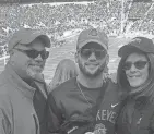  ?? COURTESY OF THE MEOLA FAMILY ?? Chase Meola, 23, of New Jersey, with his parents, Margaret and Paul Meola, at a 2016 Ohio State football game.