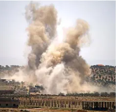  ??  ?? Smoke rises above eastern rebel-held areas of the city of Daraa during reported airstrikes by Syrian regime forces. — AFP photo