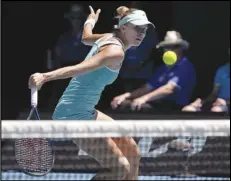  ?? Associated Press ?? Magda Linette, of Poland, plays a backhand slice to Caroline Garcia, of France, during their fourth-round match, Monday, at the Australian Open in Melbourne, Australia.