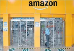  ?? MANJUNATH KIRAN AFP/GETTY IMAGES ?? Amazon accused the Future Group of violating a partnershi­p contract when it agreed to sell assets to billionair­e Mukesh Ambani’s conglomera­te last year.