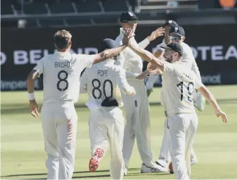  ??  ?? England’s Stuart Broad celebrates the wicket of Dwaine Pretorius of the Proteas with his team mates.