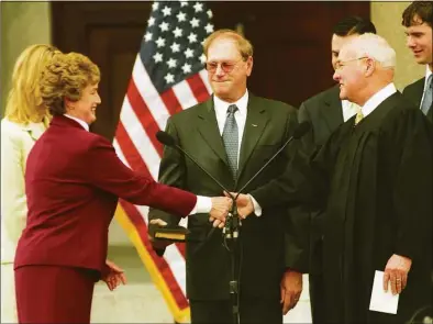  ?? Brian A. Pounds / Hearst Connecticu­t Media file photo ?? Chief Justice William J. Sullivan, right, administer­s the oath of office to Gov. M. Jodi Rell in 2004. Sullivan, who served as the 36th Chief Justice of the state Supreme Court, died at the age of 83, according to officials Tuesday.