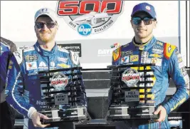  ?? TERRY RENNA/ THE ASSOCIATED PRESS ?? Pole-sitter Chase Elliott, right, and Dale Earnhardt Jr. display their front-row trophies Sunday after qualifying for the top two positions in NASCAR’s season-opening Daytona 500 next Sunday at Daytona Internatio­nal Speedway in Daytona Beach, Fla.