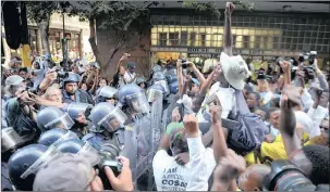  ??  ?? PROTEST: ANC supporters are removed from Longmarket Street by the public order police as last year’s State of the Nation Address gets underway.