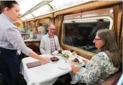  ??  ?? UK retirees Janet and David Sumner are served dinner in the Queen Adelaide Restaurant.