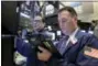  ?? RICHARD DREW — THE ASSOCIATED PRESS ?? Trader Jonathan Corpina, right, works on the floor of the New York Stock Exchange Wednesday.