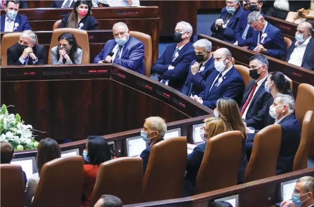  ?? (Marc Israel Sellem/The Jerusalem Post) ?? PRIME MINISTER Naftali Bennett and ministers in his coalition attend the swearing-in ceremony of President Isaac Herzog in the Knesset on Wednesday.