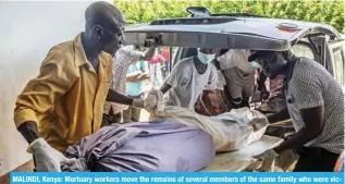  ?? ?? MALINDI, Kenya: Mortuary workers move the remains of several members of the same family who were victims of a Kenyan starvation cult at a private mortuary in Malindi on March 26, 2024. — AFP