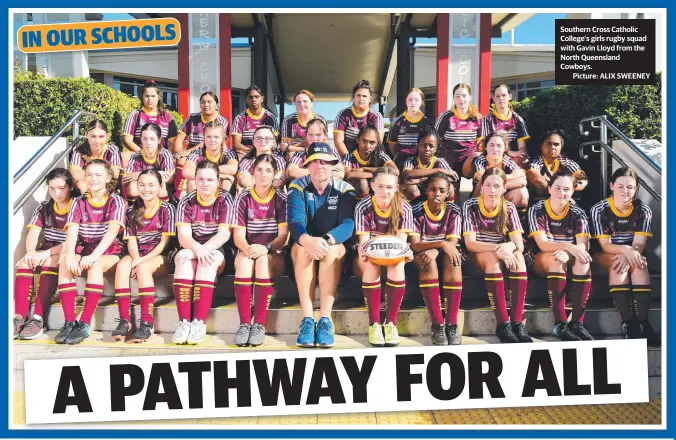  ??  ?? Southern Cross Catholic College’s girls rugby squad with Gavin Lloyd from the North Queensland Cowboys.
Picture: ALIX SWEENEY
