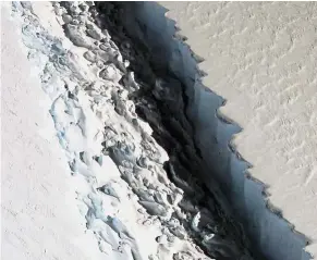  ??  ?? After months of dangling on by a miles-thin thread of ice, an iceberg calved off Antarctica’s Larsen C ice shelf.