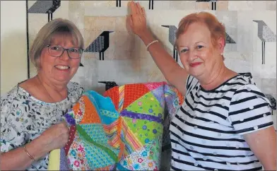  ?? ?? MANY HANDS: Wimmera hospice members Jan Ackland, left, and Jenny Gilmartin are looking forward to the quilt auction on November 6.