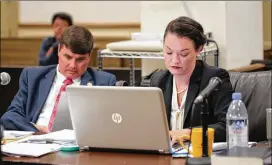  ?? MAX PELTZ / POOL PHOTO ?? District Attorney Benjamin Coker and Chief Assistant District Attorney Marie Broder make notes during the selection of potential jurors for the murder trial for Frankie Gebhardt on Monday in Spalding County Superior Court. On Monday, 53 potential jurors were qualified. Jury selection is expected to wrap up today.