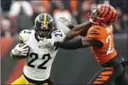  ?? CAROLYN KASTER — THE ASSOCIATED PRESS ?? Steelers running back Najee Harris stiff arms Bengals cornerback Mike Hilton during the second half Nov. 26.