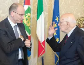  ?? — AFP ?? ROME: This handout file picture released by the Italian presidenti­al press office on April 28, 2013 shows Italian newly appointed Prime Minister Enrico Letta (L) and President Giorgio Napolitano prior to the swearing in ceremony of the new government...