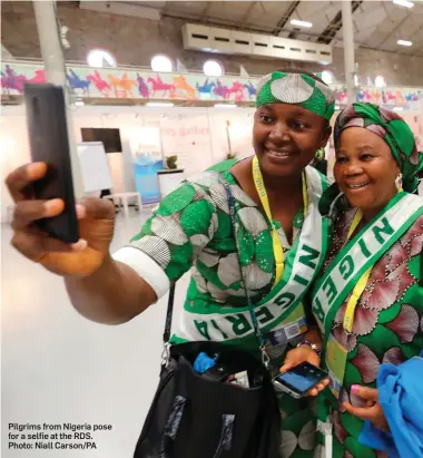  ??  ?? Pilgrims from Nigeria pose for a selfie at the RDS. Photo: Niall Carson/PA