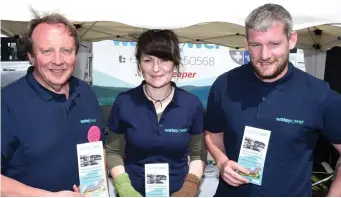  ??  ?? Dan Twomey, Ellen O’Sullivan and Jack Reen from Kanturk on the Waterpower stand at Charlevill­e Show.