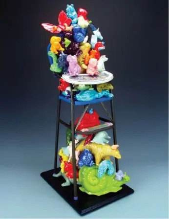  ??  ?? Wendy Walgate’s Hannibal Bear High Chair, a menagerie of porcelain animal figures.