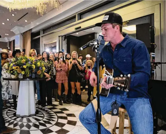  ?? Photos by Jamaal Ellis photograph­s/Contributo­r ?? Parker McCollum performed two songs last week for the crowd at the Oak Room at the Post Oak Hotel as part of a special kickoff to the rodeo season.