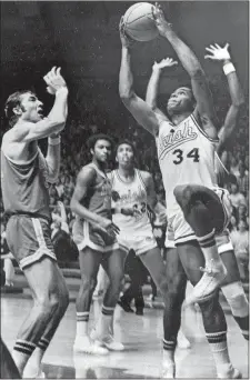  ?? AP FILE PHOTO ?? In this Jan. 23, 1971, file photo, Notre Dame’s Austin Carr goes to the basket as UCLA’s Steve Patterson, left, defends, during a college basketball game in South Bend, Ind. Carr had 46 points in an 89-82 victory. It wasn’t until Carr scored a still-standing NCAA Tournament­record 61 points against Ohio in the first round in 1970 that, in his mind, he started to separate himself.