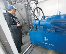  ?? Anne Cusack
Los Angeles Times ?? THERE ARE ONLY 12 locations statewide that dispense compressed hydrogen gas. Above, a compressor that fills up autos at a hydrogen fuel station in Burbank.