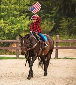  ?? ?? Families can rent a log cabin while children experience a hands-on horsemansh­ip program.