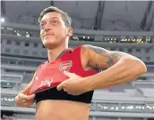  ??  ?? POPULAR Ozil has said he wants to stay at Arsenal